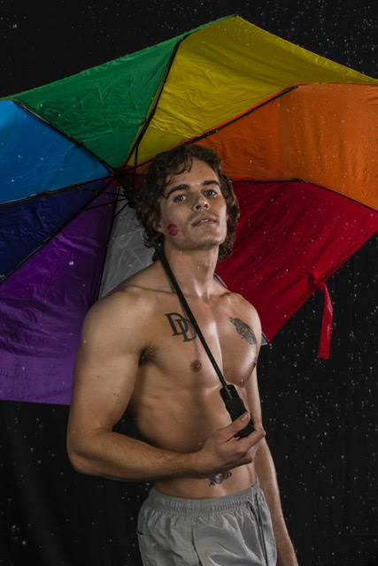 Holding Rainbow Umbrella